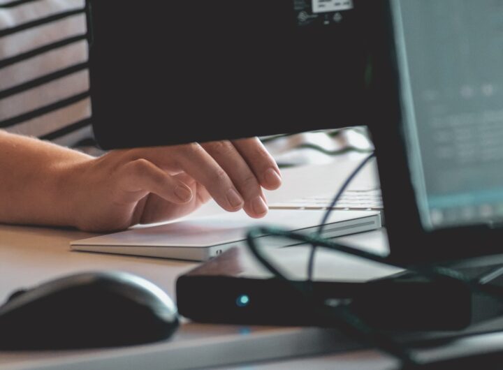person using computer on table