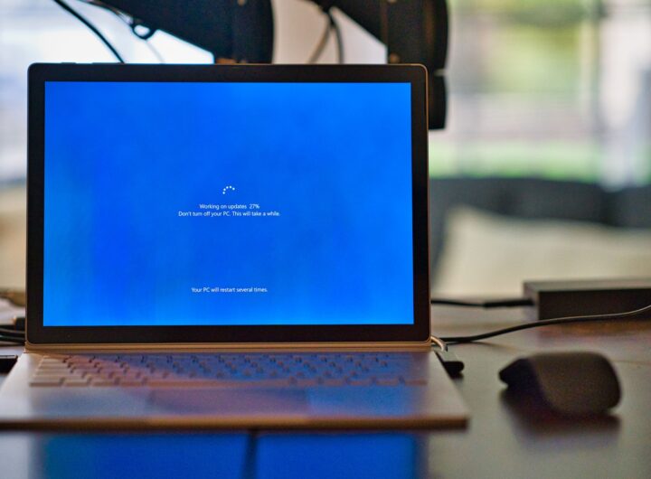macbook pro on brown wooden table