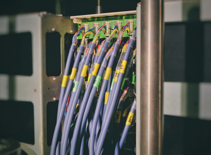 blue LAN cable plugged in green and black router