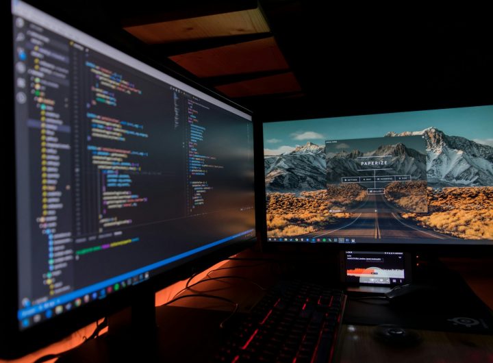two black flat screen computer monitors