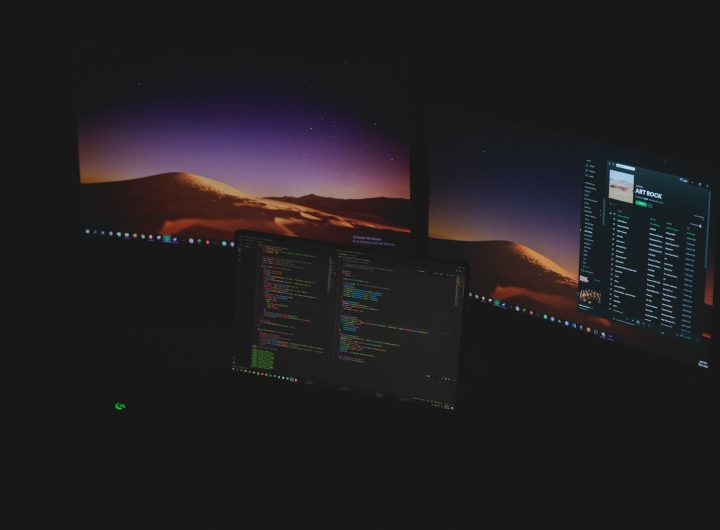 black flat screen computer monitor turned on near blue and white sky