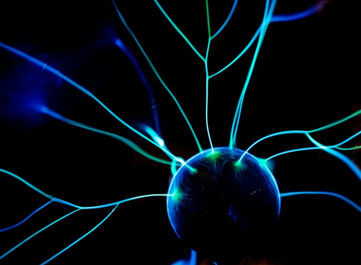 a close up of a blue light in the dark