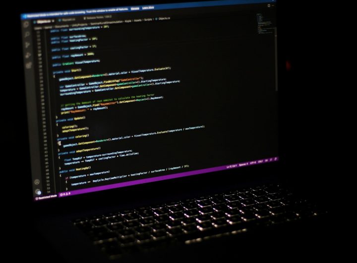 a laptop computer sitting on top of a desk