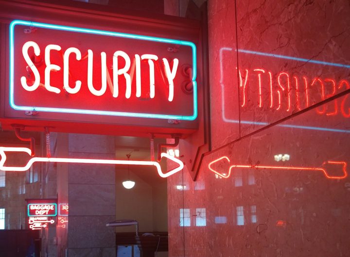 a red security sign and a blue security sign